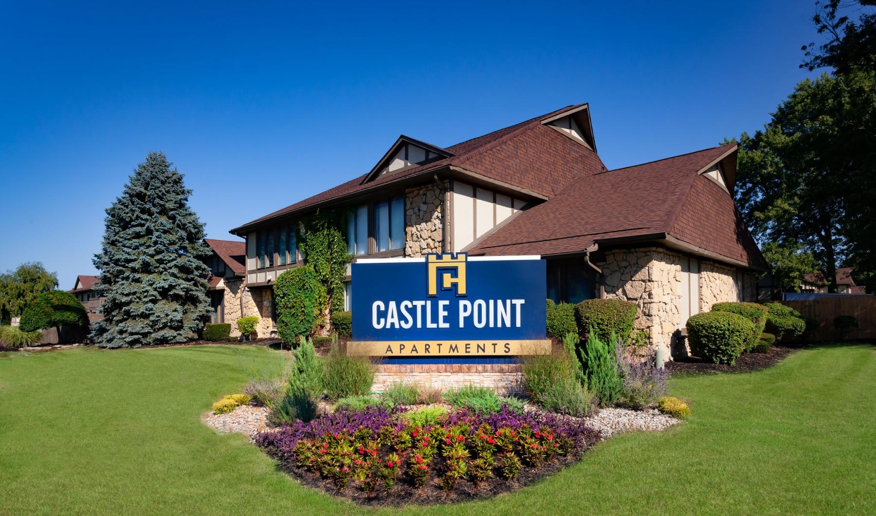 an entrance with a sign in front